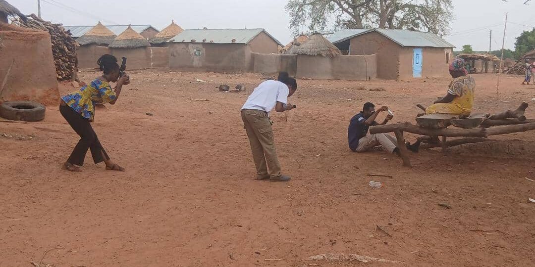 A focused trio of photographers